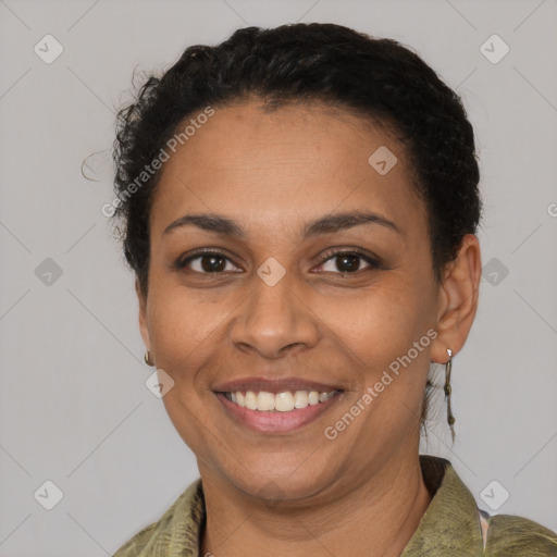 Joyful latino young-adult female with short  black hair and brown eyes