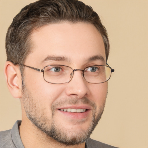 Joyful white adult male with short  brown hair and brown eyes