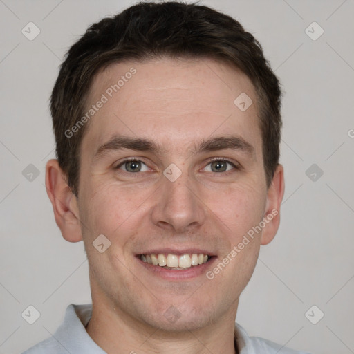 Joyful white adult male with short  brown hair and grey eyes