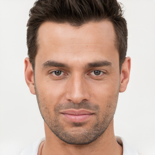 Joyful white young-adult male with short  brown hair and brown eyes