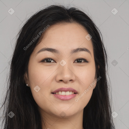 Joyful asian young-adult female with long  brown hair and brown eyes