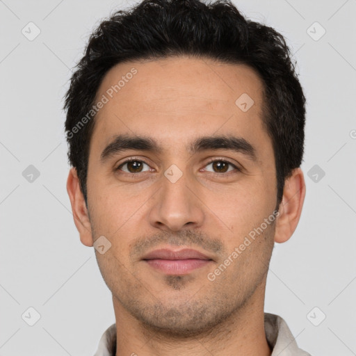 Joyful white young-adult male with short  black hair and brown eyes