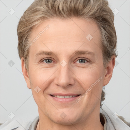 Joyful white adult female with short  brown hair and grey eyes