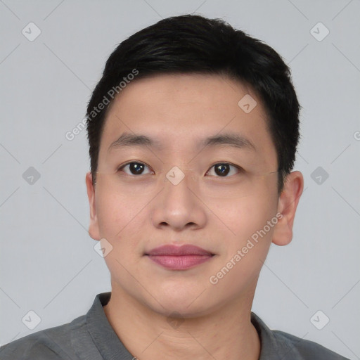 Joyful asian young-adult male with short  black hair and brown eyes