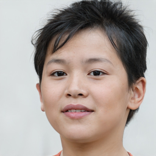 Joyful asian child female with short  brown hair and brown eyes