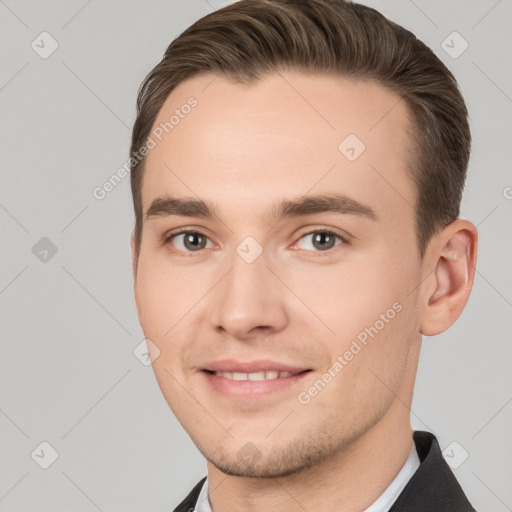 Joyful white young-adult male with short  brown hair and brown eyes