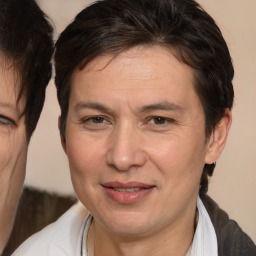 Joyful white adult male with medium  brown hair and brown eyes