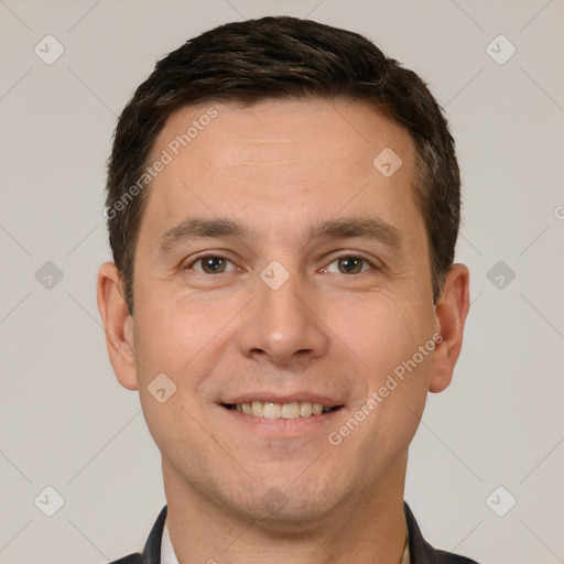 Joyful white adult male with short  brown hair and brown eyes