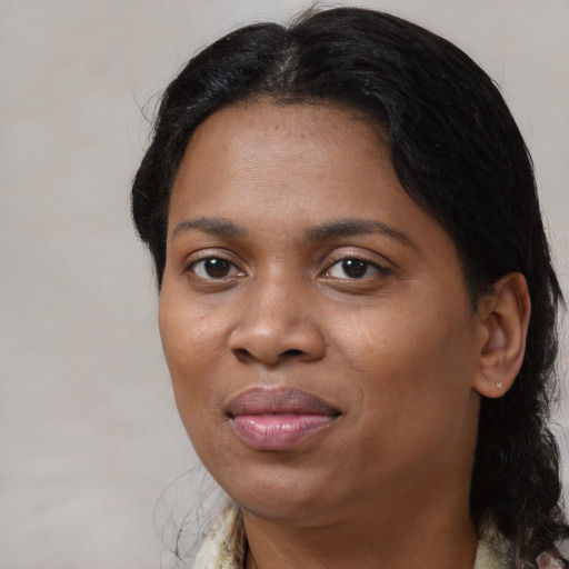 Joyful black young-adult female with medium  brown hair and brown eyes