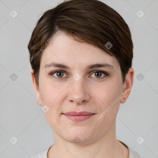 Joyful white young-adult female with short  brown hair and grey eyes