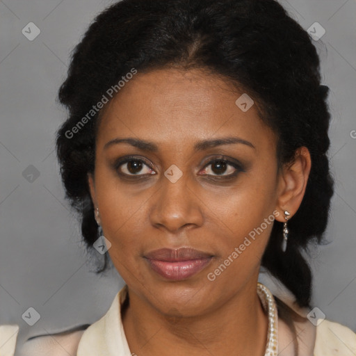 Joyful black adult female with medium  brown hair and brown eyes