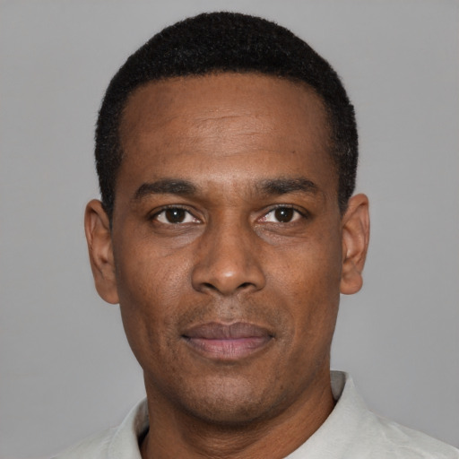 Neutral black young-adult male with short  black hair and brown eyes
