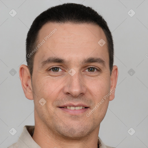 Joyful white adult male with short  brown hair and brown eyes