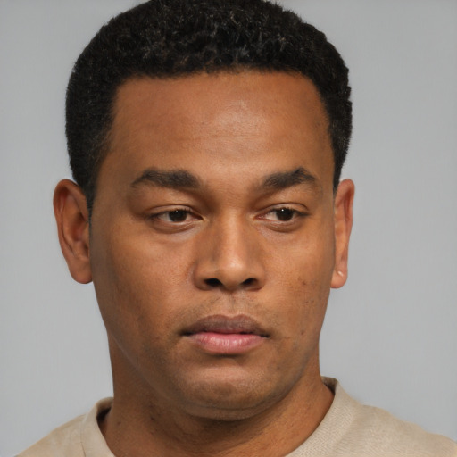 Neutral black young-adult male with short  black hair and brown eyes