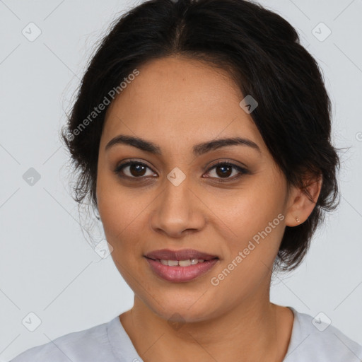 Joyful latino young-adult female with medium  brown hair and brown eyes