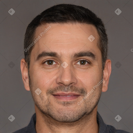 Joyful white adult male with short  brown hair and brown eyes