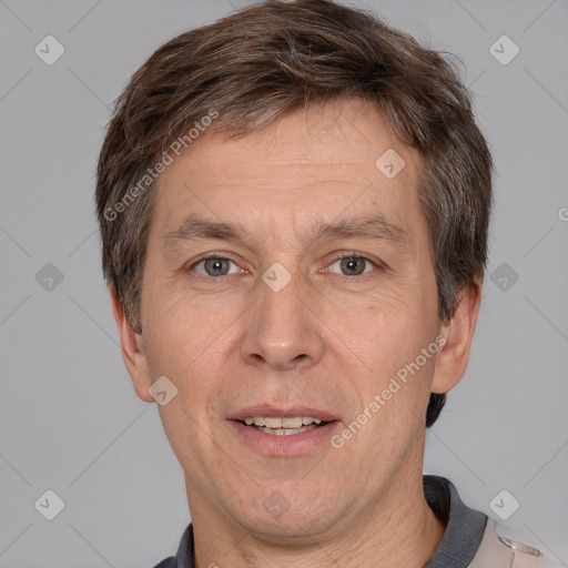 Joyful white adult male with short  brown hair and grey eyes