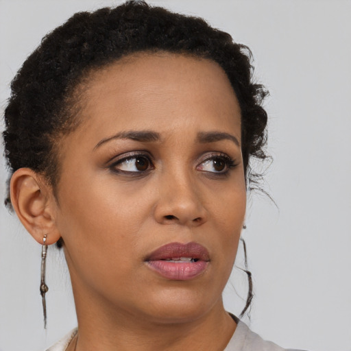 Neutral black young-adult female with short  brown hair and brown eyes