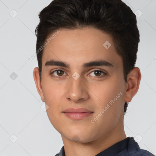 Joyful white young-adult male with short  brown hair and brown eyes