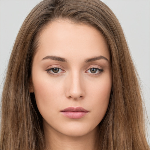 Neutral white young-adult female with long  brown hair and brown eyes