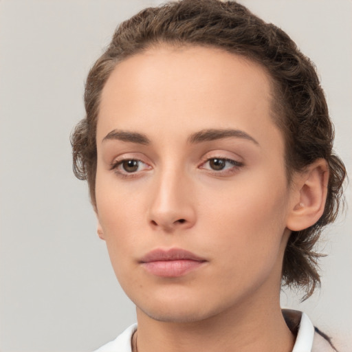 Neutral white young-adult female with short  brown hair and brown eyes