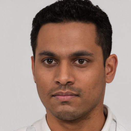 Neutral latino young-adult male with short  black hair and brown eyes