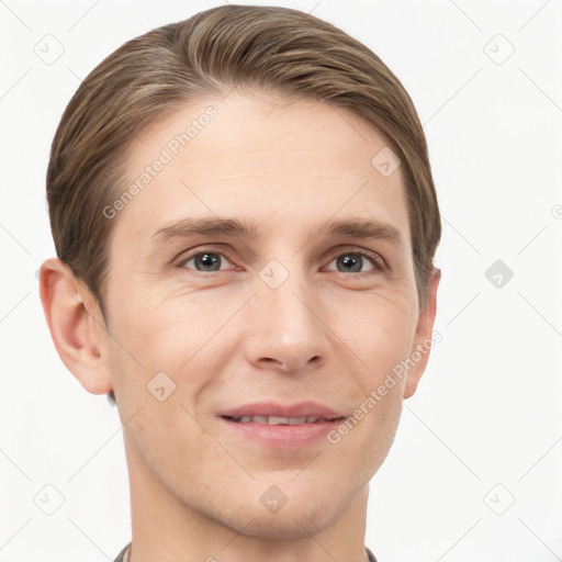 Joyful white young-adult male with short  brown hair and grey eyes