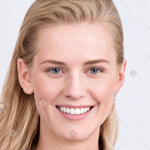 Joyful white young-adult female with long  brown hair and blue eyes