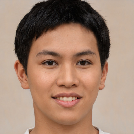 Joyful asian young-adult female with short  brown hair and brown eyes