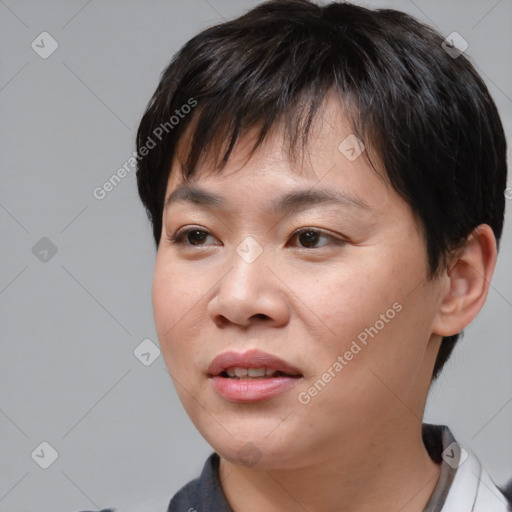 Joyful asian young-adult female with medium  brown hair and brown eyes