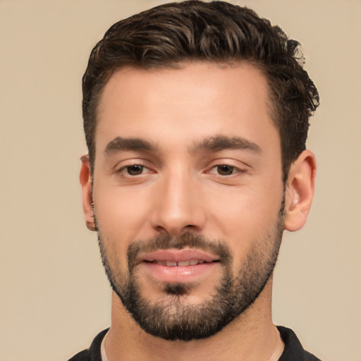 Joyful white young-adult male with short  black hair and brown eyes