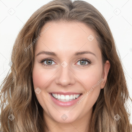 Joyful white young-adult female with long  brown hair and green eyes