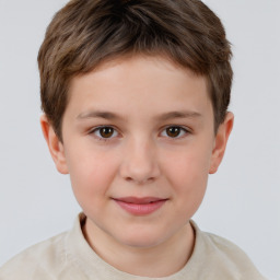 Joyful white child male with short  brown hair and brown eyes