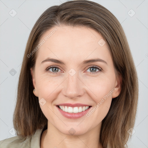 Joyful white young-adult female with medium  brown hair and grey eyes