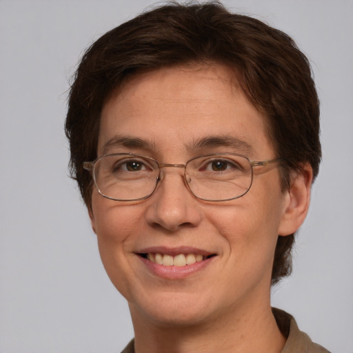 Joyful white adult female with short  brown hair and grey eyes