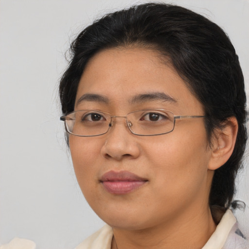 Joyful asian young-adult female with medium  brown hair and brown eyes