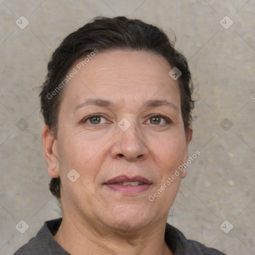 Joyful white adult female with short  brown hair and brown eyes