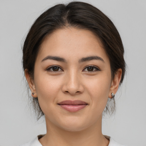 Joyful white young-adult female with medium  brown hair and brown eyes