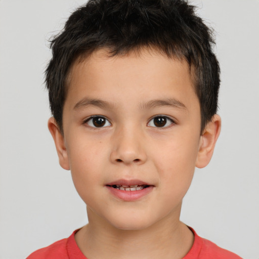 Joyful white child male with short  brown hair and brown eyes