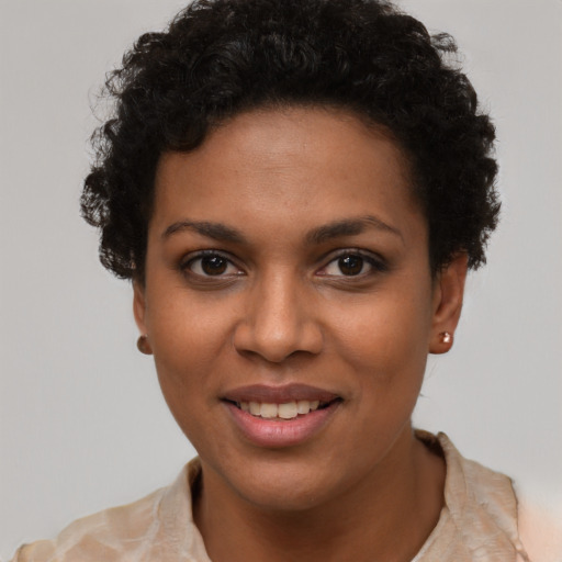 Joyful latino young-adult female with short  brown hair and brown eyes
