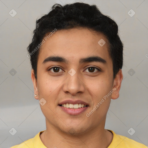 Joyful latino young-adult male with short  black hair and brown eyes