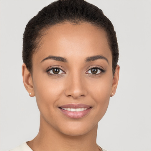 Joyful white young-adult female with short  brown hair and brown eyes