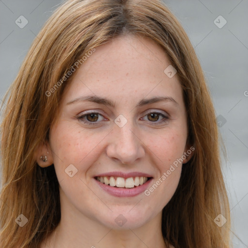 Joyful white young-adult female with long  brown hair and grey eyes