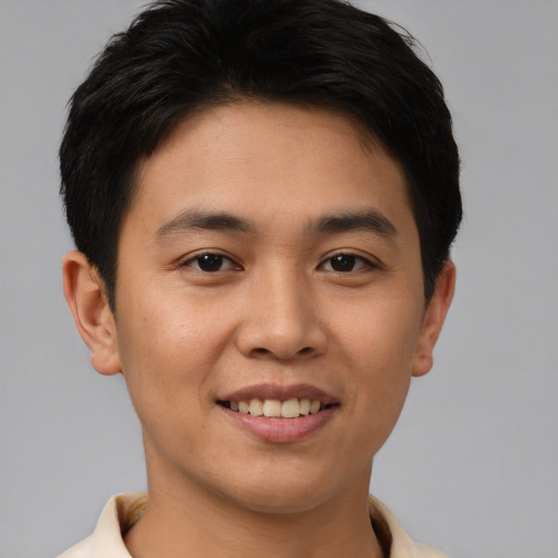 Joyful asian young-adult male with short  brown hair and brown eyes