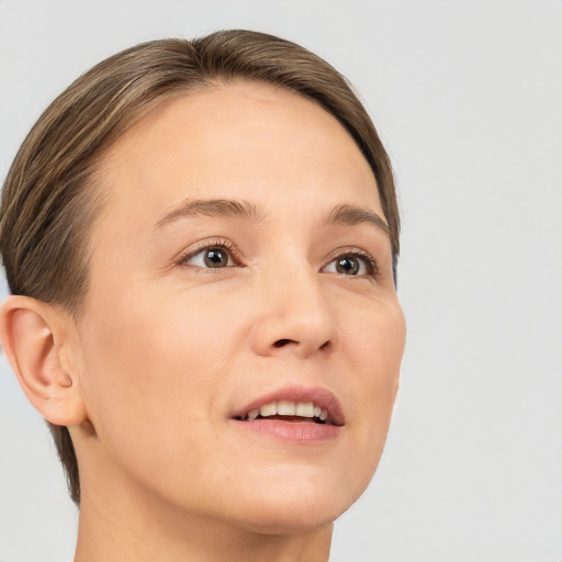 Joyful white young-adult female with medium  brown hair and brown eyes