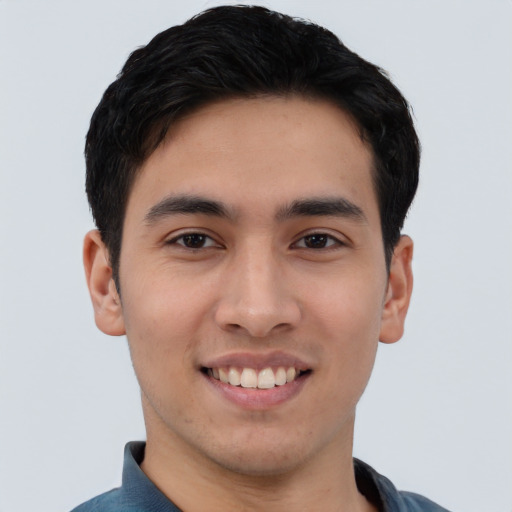 Joyful asian young-adult male with short  black hair and brown eyes