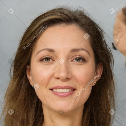 Joyful white adult female with long  brown hair and brown eyes