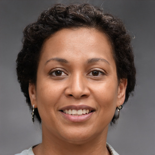 Joyful white adult female with short  brown hair and brown eyes