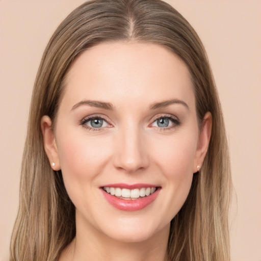 Joyful white young-adult female with long  brown hair and grey eyes