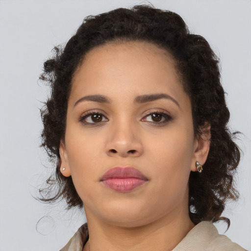 Neutral black young-adult female with medium  brown hair and brown eyes